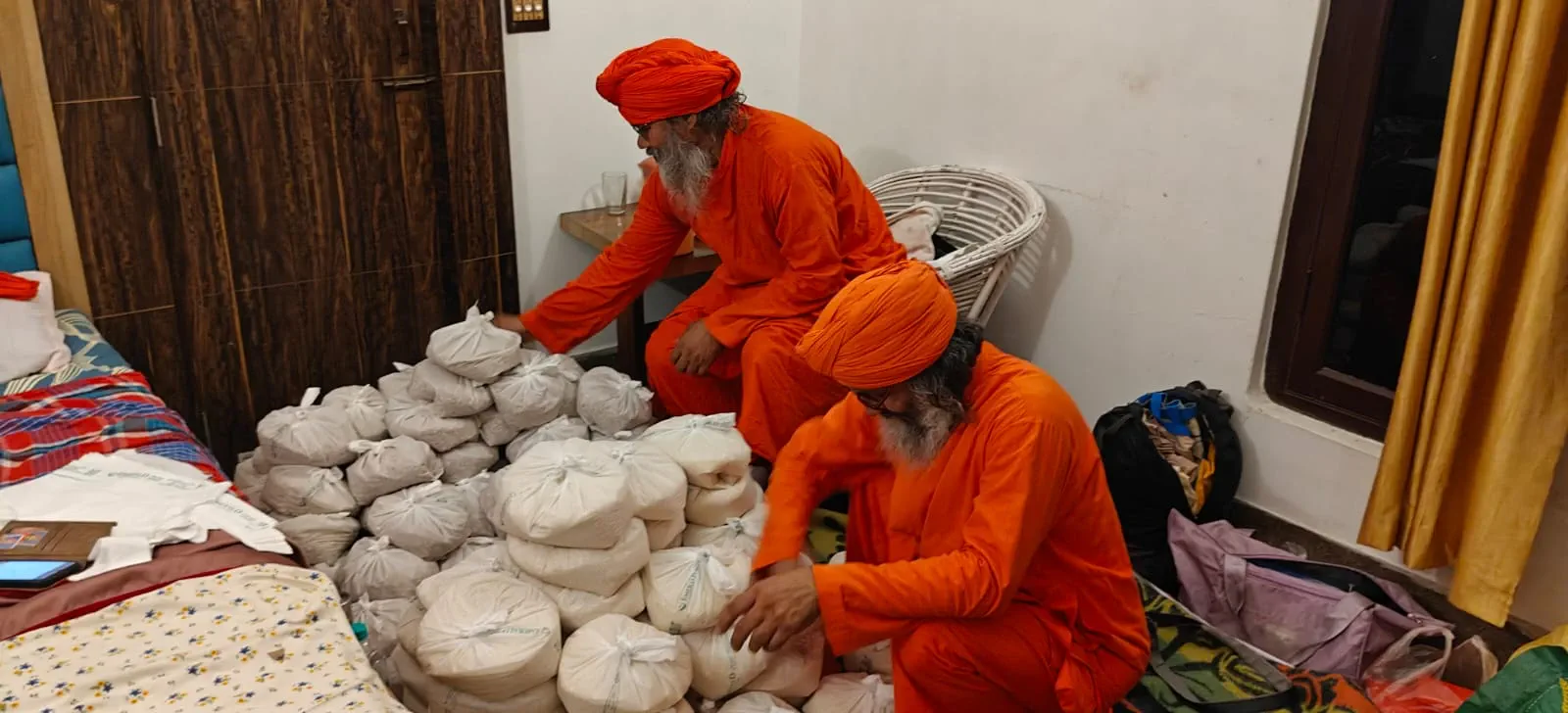 Monks preparing food parcels for distribution