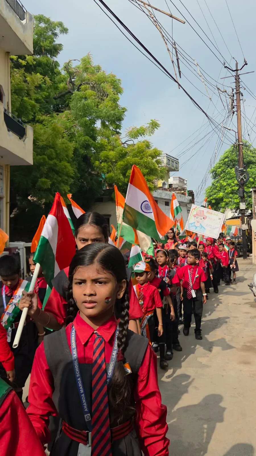A student leads the Independence Day march