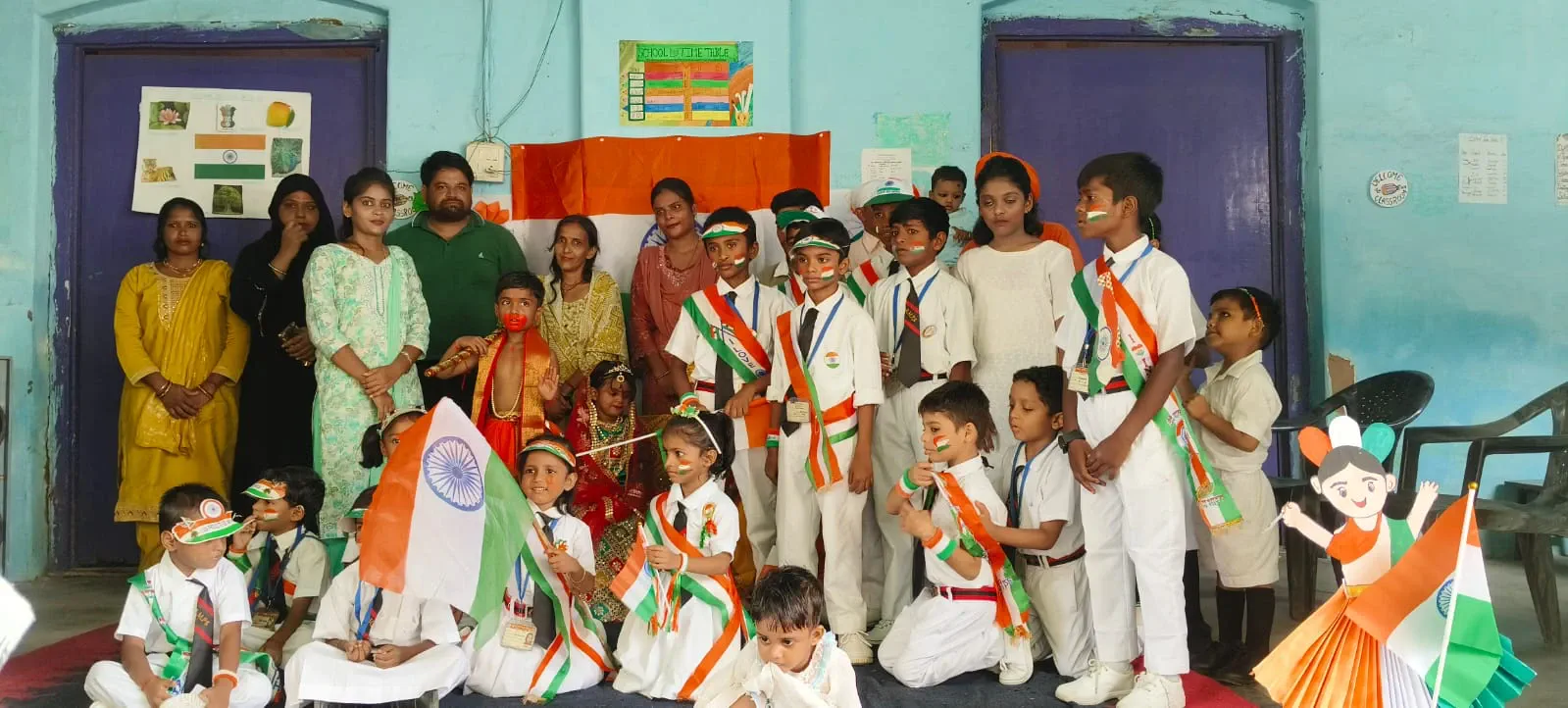 School function — students and teachers with the tricolour
